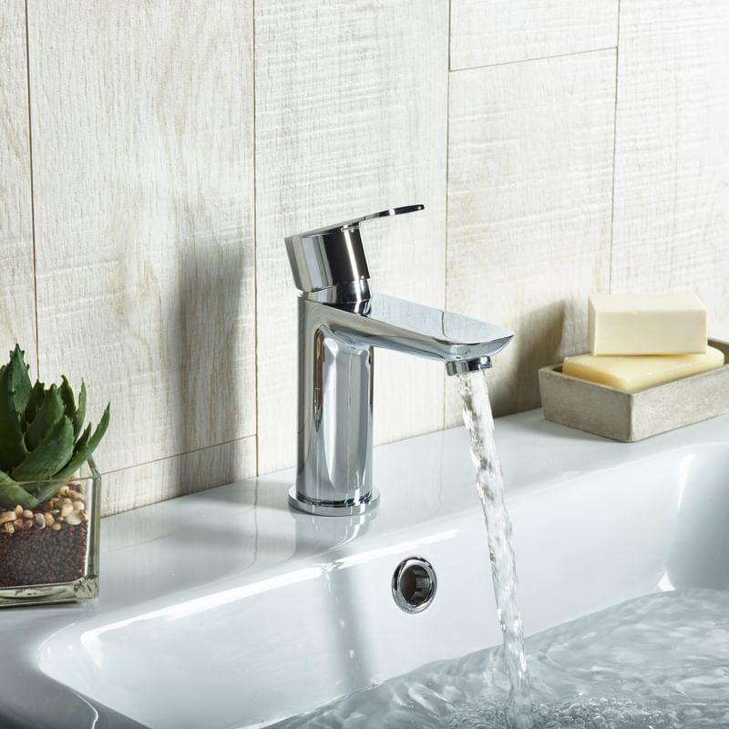Crew basin mixer top lifestyle with water Crew basin mixer top lifestyle with water