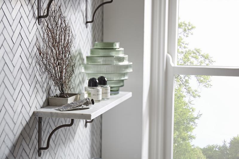 How to style a shelf depth of field single shelf hand cream tree window scene