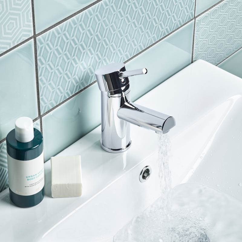 Joy basin mixer top lifestyle with water Joy basin mixer top lifestyle with water