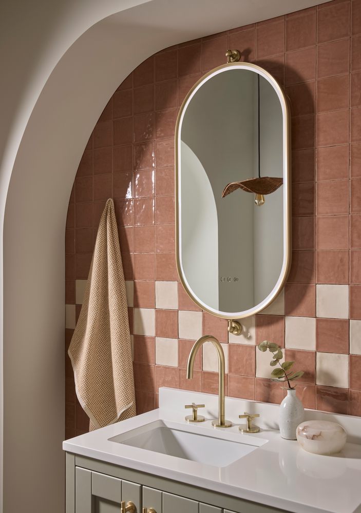 Alderbury Pill Brass Mirror Lifestyle slide image Alderbury Pill Brass Mirror Lifestyle slide image