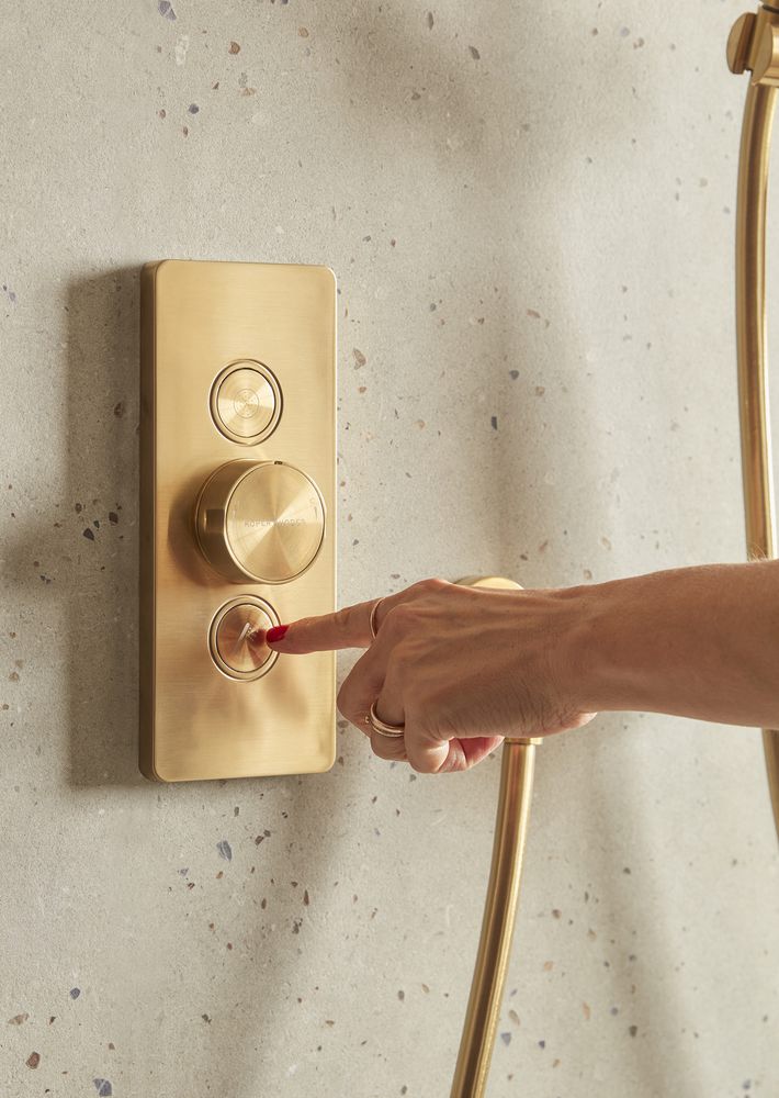 Event Click Brushed Brass Dual Function Valve Handset With Hand Lifestyle slide image Event Click Brushed Brass Dual Function Valve Handset With Hand Lifestyle slide image