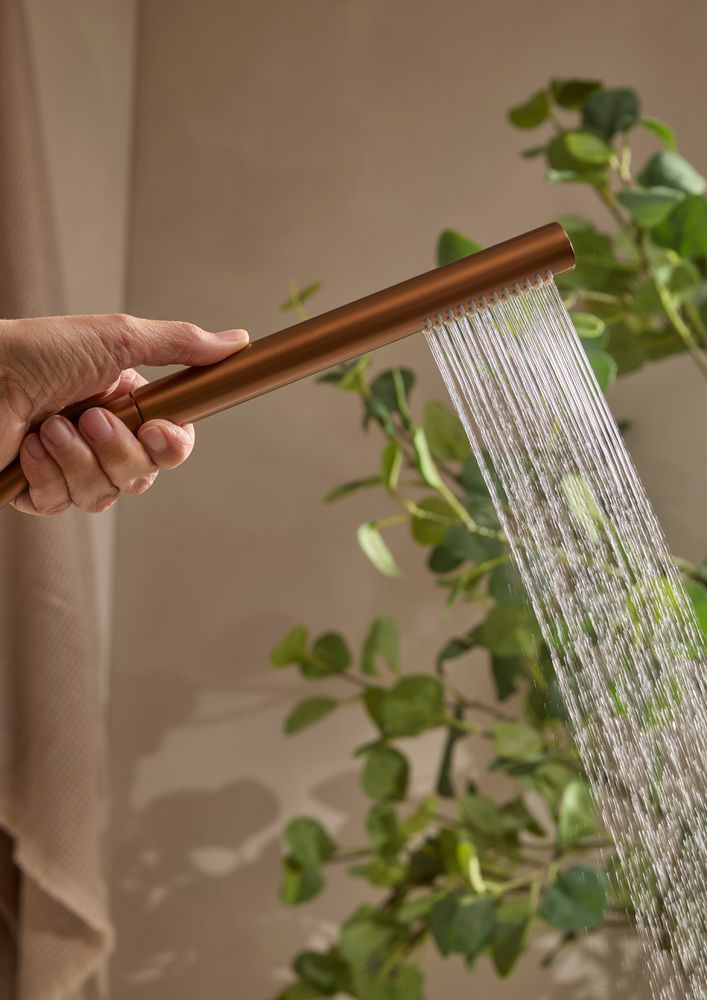 Faber Brushed Bronze Shower Handset Detail Lifestyle slide image Faber Brushed Bronze Shower Handset Detail Lifestyle slide image