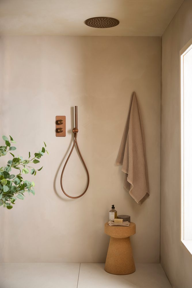 Faber Brushed Bronze dual function Shower with handset Lifestyle slide image Faber Brushed Bronze dual function Shower with handset Lifestyle slide image