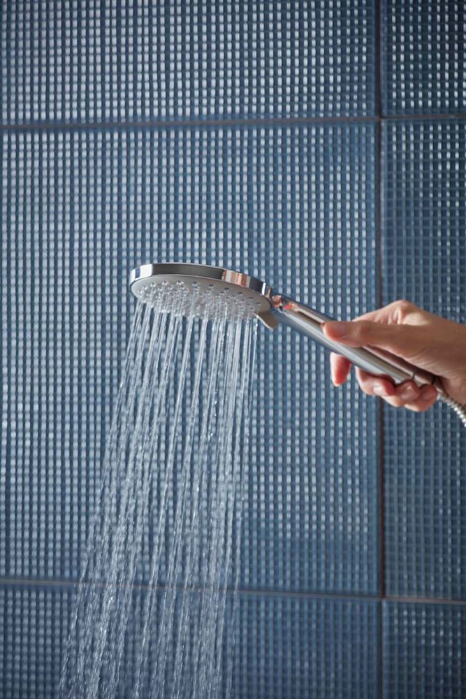 Joy Shower Handset Lifestyle with Hand slide image Joy Shower Handset Lifestyle with Hand slide image