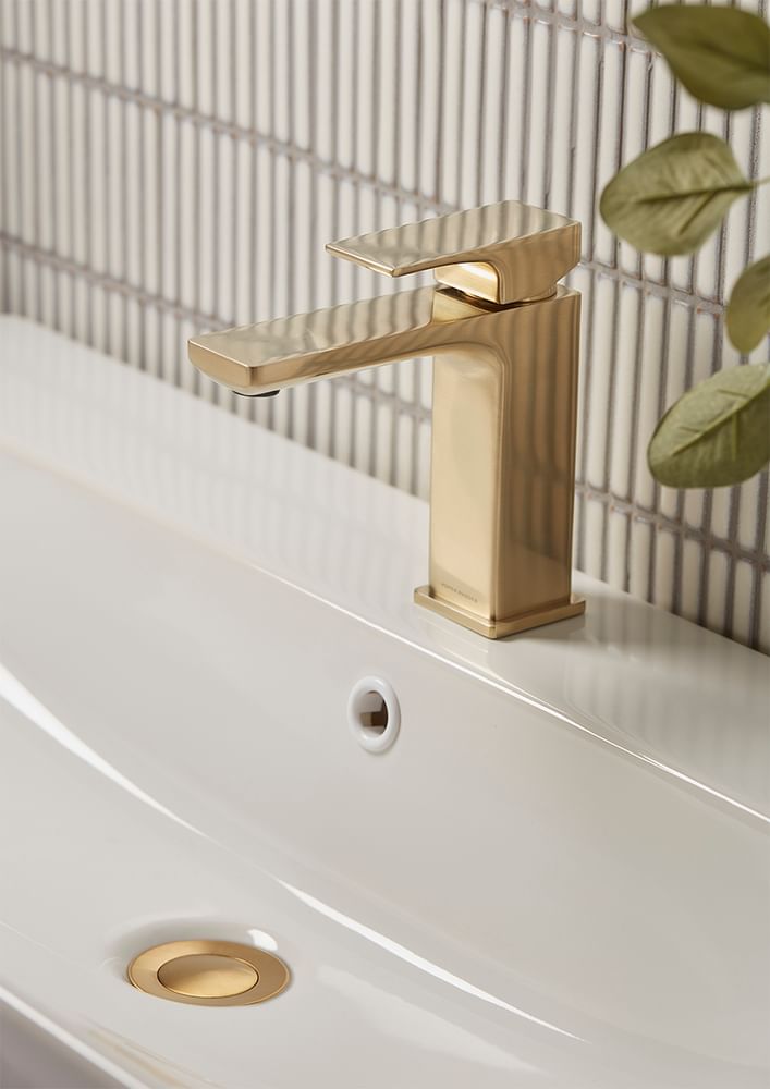 Metric Brushed Brass Basin Mixer Tap with Brass Waste Lifestyle slide image Metric Brushed Brass Basin Mixer Tap with Brass Waste Lifestyle slide image