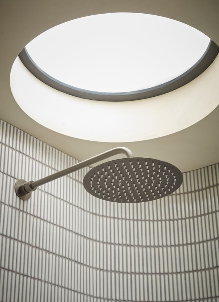 Quantum Shower Head Close Up With Arm Lifestyle slide image Quantum Shower Head Close Up With Arm Lifestyle slide image