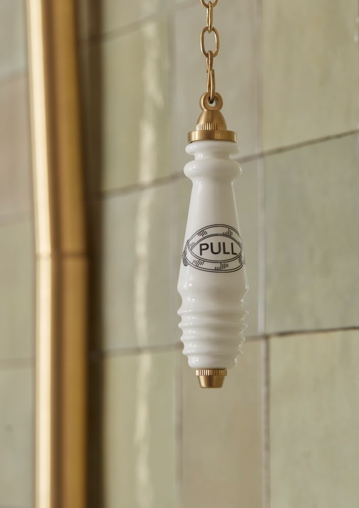 Tavistock Vitoria sanitaryware chain pull close up lifestyle slide image Tavistock Vitoria sanitaryware chain pull close up lifestyle slide image