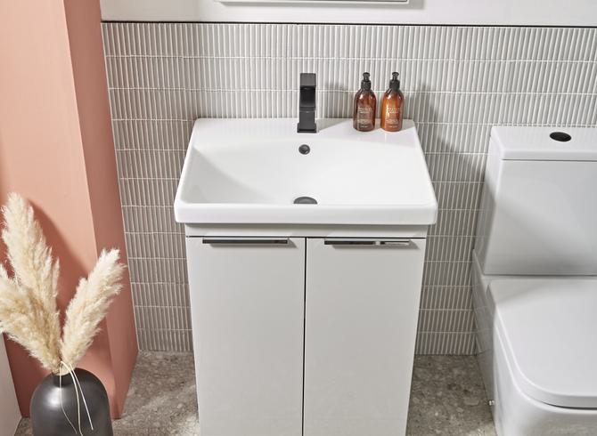 Type 600mm light grey freestanding unit top down with Serenity CC WC and Serve black tap lifestyle